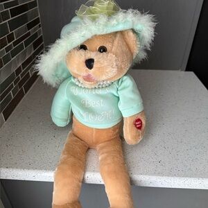CHANTILLY Lane Musical Singing Plush Teddy Bear wearing a Light Green Dress.
